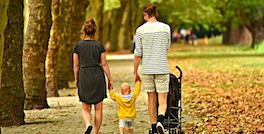 family walking down the park